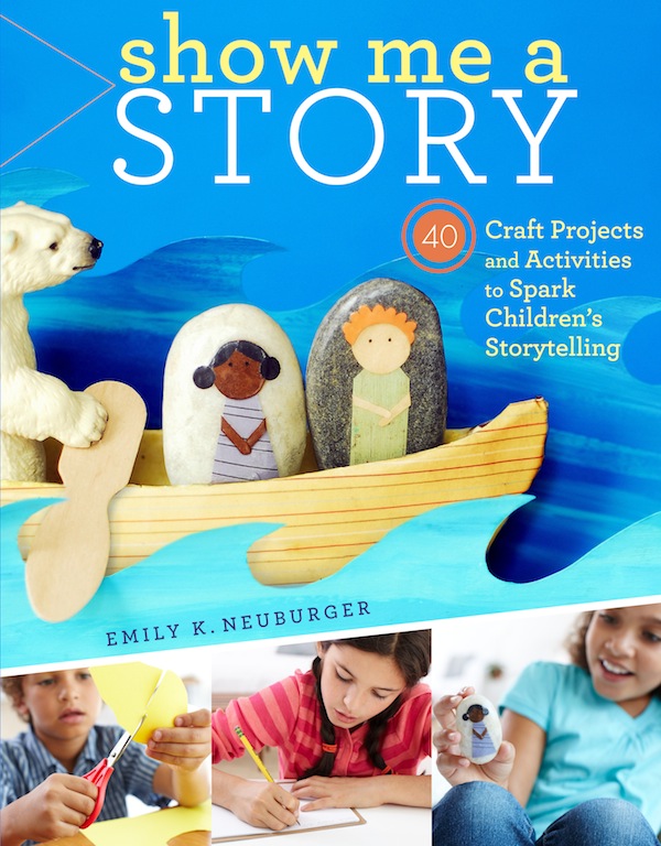 The cover of Show me a Story has a handmade toy boat including two human figures appliqued onto stones, being rowed by a plastic polar bear using a popsicle stick as a paddle.  There are also three images of children cutting paper, writing or drawing with a pencil, and playing with a hand made Story Stone